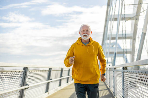 istock Senior athlete jogging on the bridge 2078710757