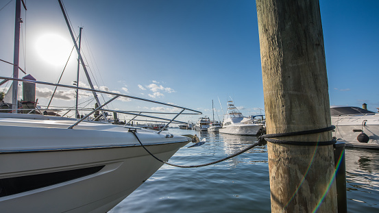 Breathtaking romantic summer panoramic view of boats and yachts in harbor in evening sunshine glow. Costa Blanca. Alicante, province of Valencia, Spain.