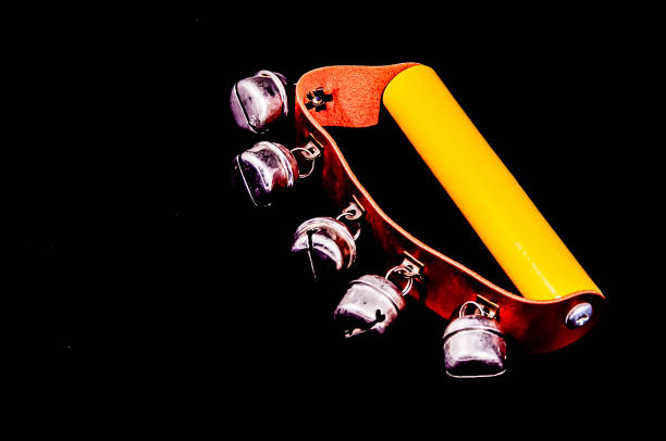 Hand bells musical instrument for ringing on a black background