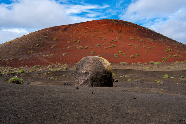 The most beautiful volcanic bomb in Lanzarote. Against the background of the red Caldera, Colorada looks majestic.