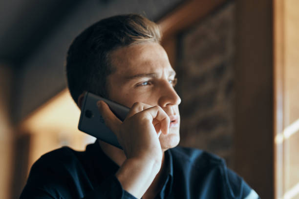 istock Businessman with mobile phone in cafe at table, cropped view 2078760306