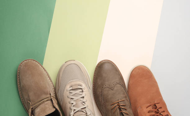 istock Different men's shoes on a colored background. Top view. Creative fashion layout 2078762403