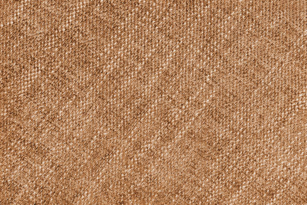 Coarse weave jacquard fabric texture background, orange cloth texture. Textile background, furniture textile material, wallpaper, backdrop. Textile structure close up.
