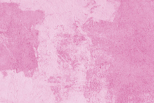 Old stucco plaster surface, concrete wall background, close up grunge texture of pink painted cement texture. Wallpaper, backdrop, architecture design element