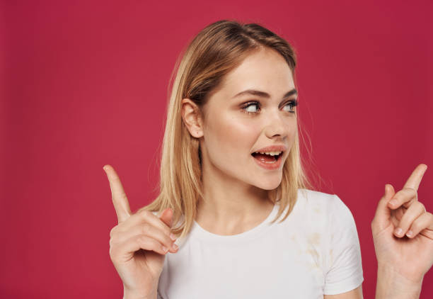 istock Hand gesturing index finger happy blonde red model background 2078782540
