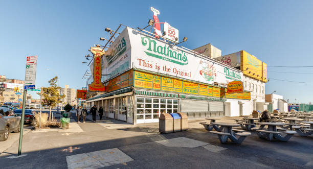 nathan's fast food stand restaurant in coney island, ney york, usa - nathans coney island new york city brooklyn стоковые фото и изображения