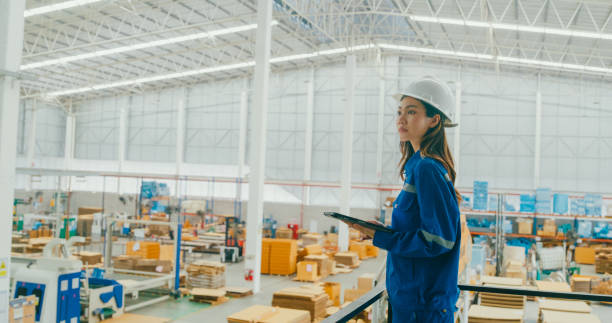 istock Professional Asian female industrial engineers use tablet while standing in manufacturing factory. Working in manufacturing plant or production plant. 2078822027