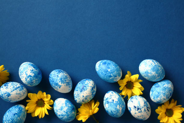 istock Blue and white Easter eggs with yellow flowers. Happy Easter card 2078822032