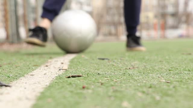 Playing football at the stadium in the courtyard in the city of Dnipro in Ukraine