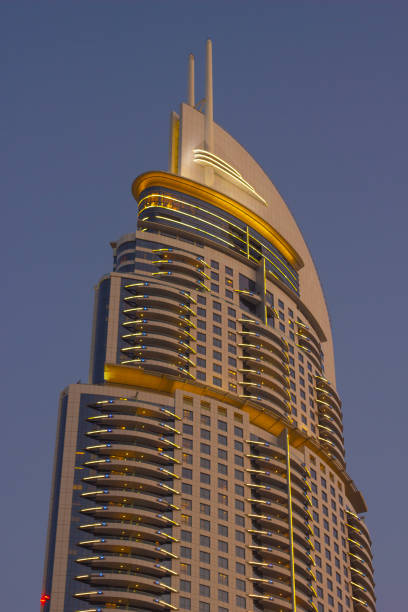 DUBAI, UAE - NOVEMBER 13: Night view of Hotel The Address in The Dubai Mall, the world's largest shopping and entertainment centre. High rise buildings and streets nov 13. 2012  in Dubai, UAE