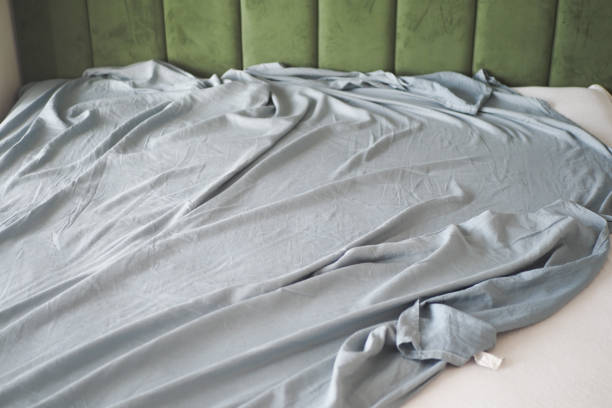 istock messy bed in early morning , messy bed after waking up 2078857085