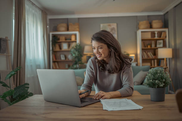 istock Young happy and successful businesswoman  working with documents inside home office 2078864416