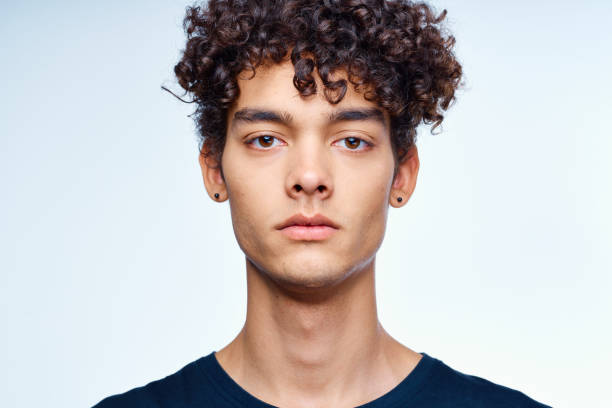 istock cute guy curly hair face close up skin care studio 2078868690