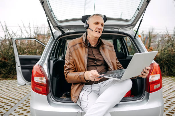 istock Man going to work and trying to work same time having important on line meeting 2078896609
