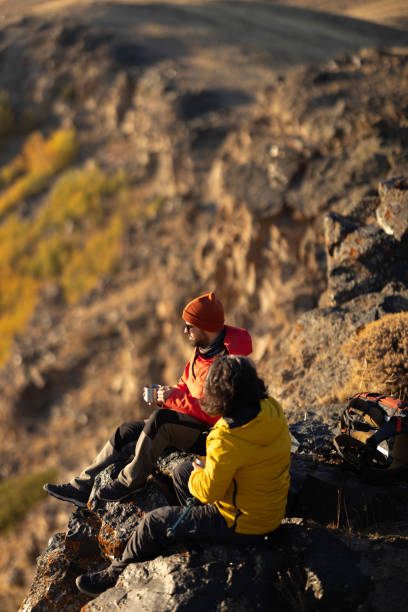 istock Hiking male ascending mountain meadow crest. 2078903419