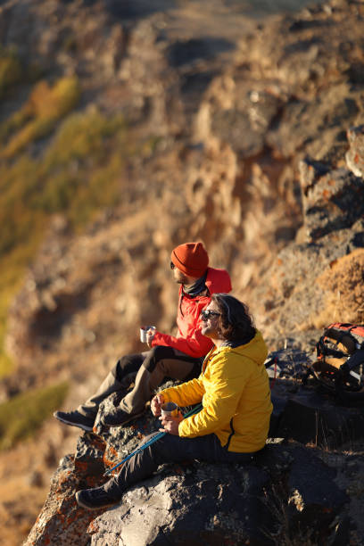 istock Hiking male ascending mountain meadow crest. 2078905517