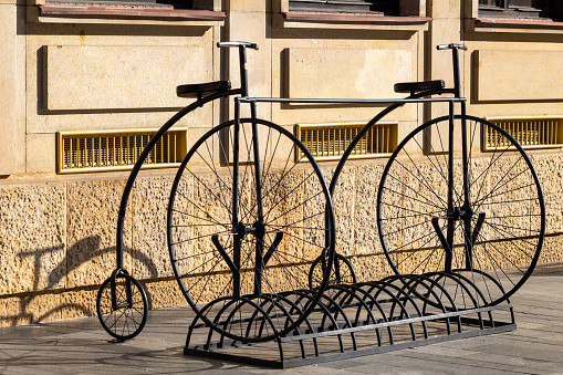 Empty bike stand with two penny farthing replicas in Bratislava old town