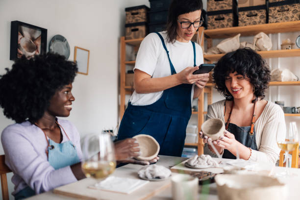 istock Teacher taking photos of handmade earthenware on pottery class. 2078924543