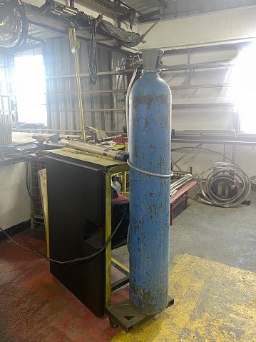 Industrial oxygen tank for welding in metal factory. Metal industry equipment