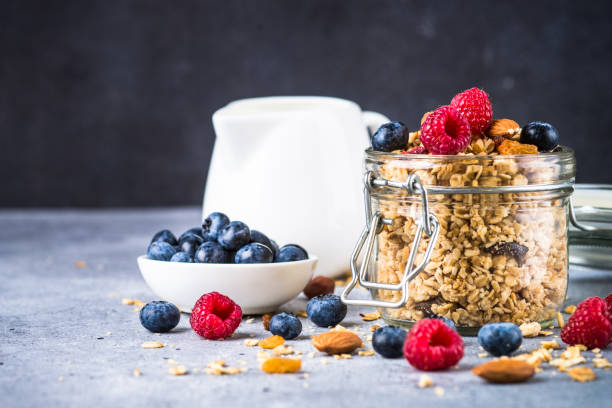 istock Granola with fresh berries in the glass jar. 2078936794