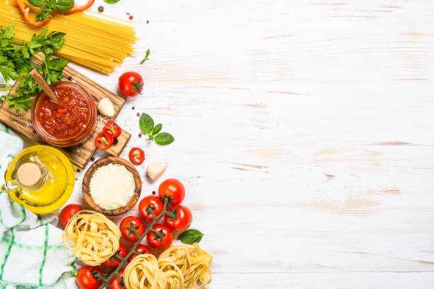 istock Italian food background at white bkitchen table. 2078946264
