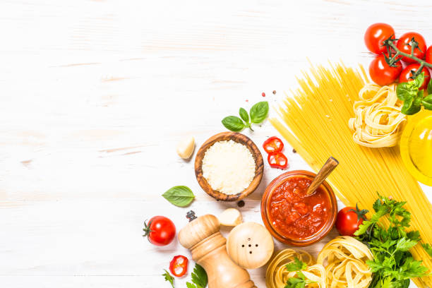 istock Italian food background at white bkitchen table. 2078950414