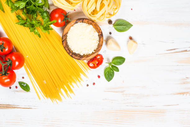 istock Italian food background at white bkitchen table. 2078950415