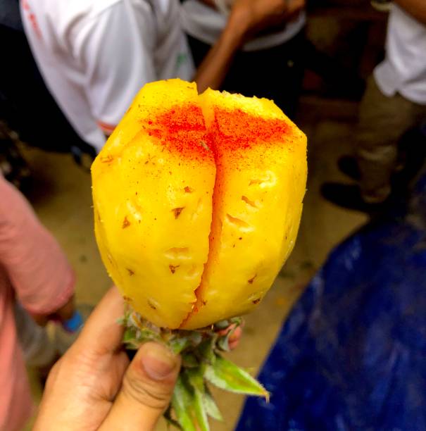 City Riga, Latvia. Street Restaurant food festival. Pineapples are fried on the street. 18.01.2020