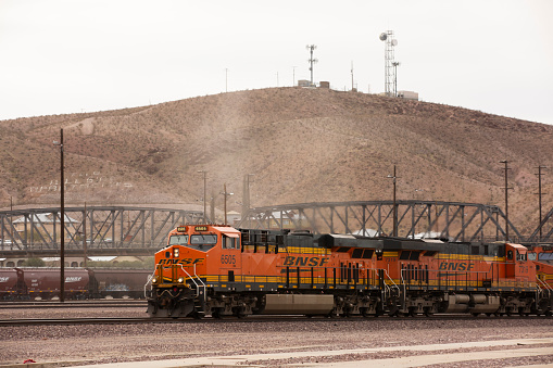 Barstow, California, USA - June 20, 2020: Trains pass through the heart of downtown Barstow.
