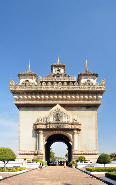 Vientiane, Laos: Patuxai (literally Victory Gate or Gate of Triumph) - Patuxai was built in the 1960s as the “Monument to the Heroes of the Royal Army”, celebrating Laos' independence from France (1949). It was popularly known simply as Anousavali (monument) or in French as the 'Monument Aux Morts'. In 1995, on the 20th anniversary of the seizure of power by the communists of Pathet Lao, the triumphal arch was given the new dedication to “The Heroes of August 23, 1975” (Day of the Communist seizure of power in Vientiane).
