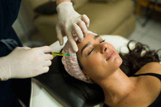 istock Beautiful woman looking relaxed getting plasma PRP treatment 2079013723