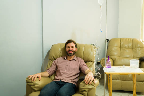 istock Excited man healing using IV drip therapy at the health clinic 2079019094
