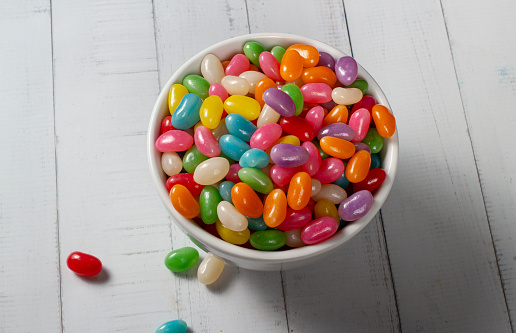Colorful  jelly beans in a bowl on the table.