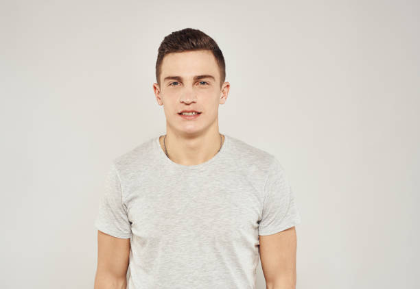 istock cheerful emotional man gesturing with his hands close-up light background 2079027886