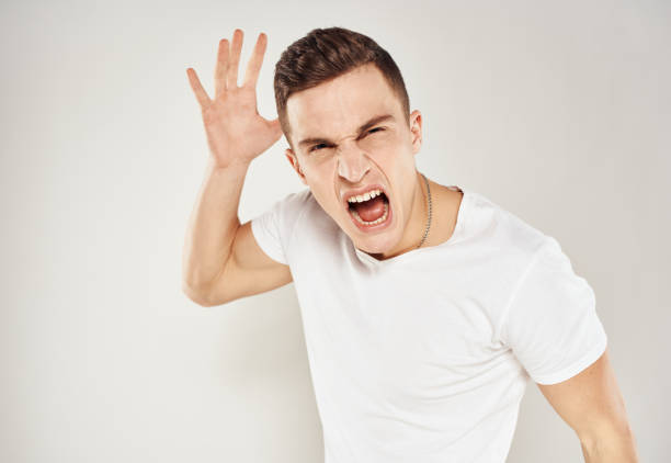 funny facial expression of stressed asian man, isolated on white background