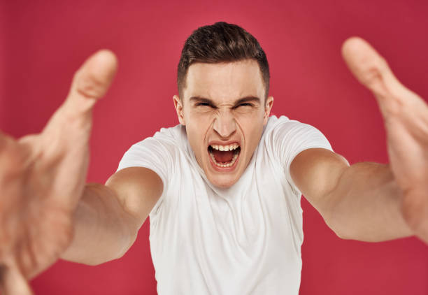 istock Man made t-shirts with 6 hands discontent red background emotions 2079044237