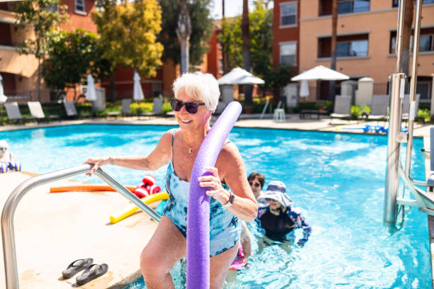 istock Senior ladies enjoying water aerobics class 2079060037