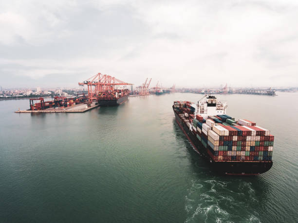 istock Aerial view of cargo container ship approaching port. 2079065637