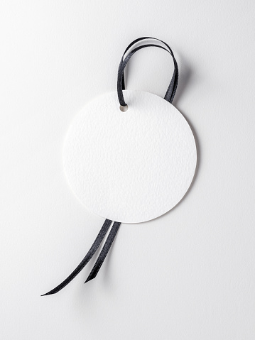 Blank white label template with black ribbon on white background