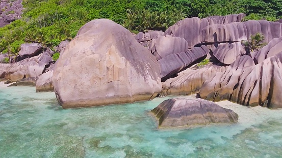 Anse Source D'Argent Beach in La Digue, Seychelles. Aerial view of tropical coastline on a sunny day.