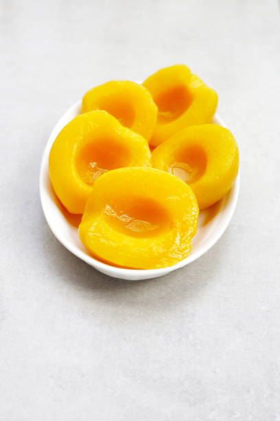 istock Peach halves in syrup. Fruity desserts 2079147199