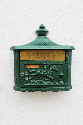 vintage mailbox on the wall of a house