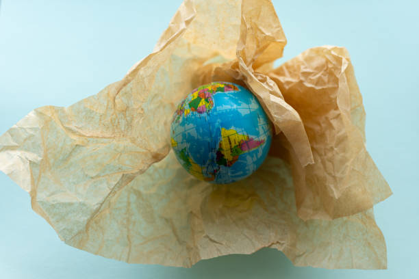 istock globe in a kraft bag, recycling concept 2079176243