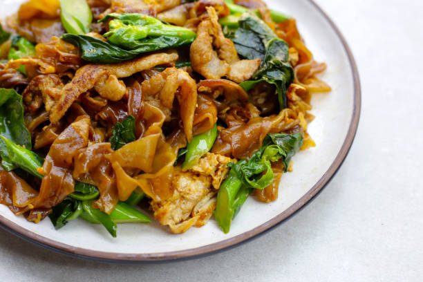 istock Stir-fried rice noodles with soy sauce and pork 2079192238