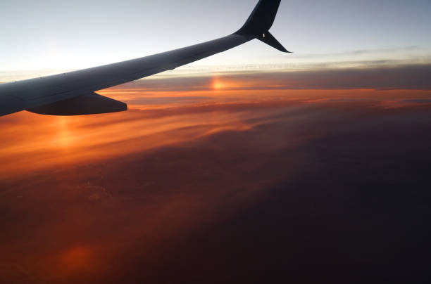 istock aerial view of airplane wing above dramatic pyrocumulus sunset cloud 2079219937