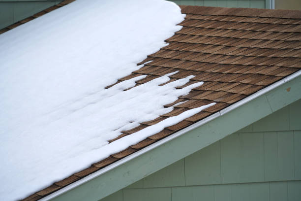 Roofing is covered with asphalt shingles on roof top of newly constructed house
