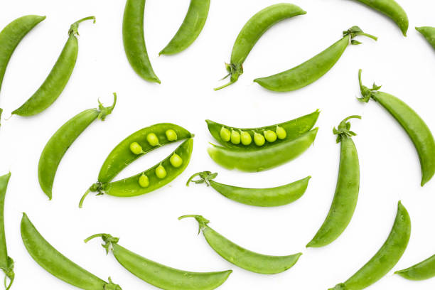 istock Fresh young green peas on white background. 2079251045