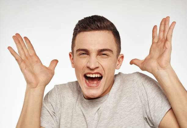 istock cheerful emotional man gesturing with his hands close-up light background 2079275329