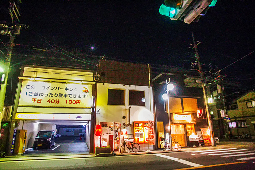 03-25-2015  KYOTO   JAP  Car service (or car lots) and  2 small cafes next to  in Kyoto