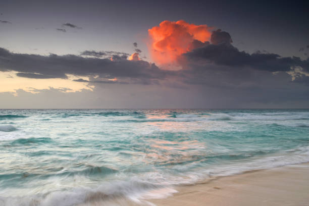 cloud igniting by morning sunlight above Caribbean sea